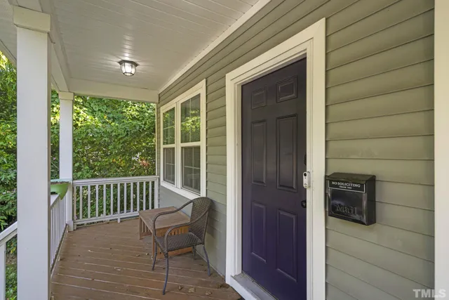 a view of a balcony with furniture