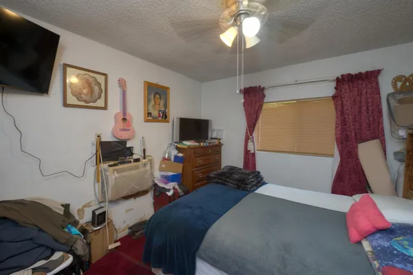 a kitchen with a sink cabinets and a window