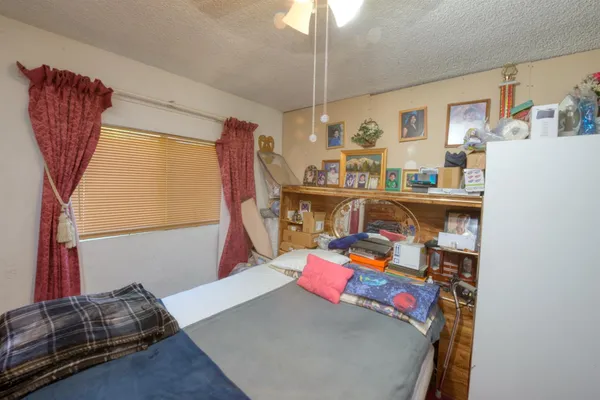 a bedroom with a bed and a walk in closet