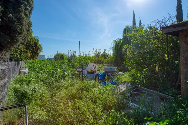 an aerial view of a house with a yard basket ball court and outdoor seating