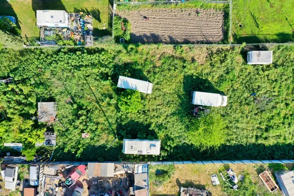 an aerial view of multiple houses with yard