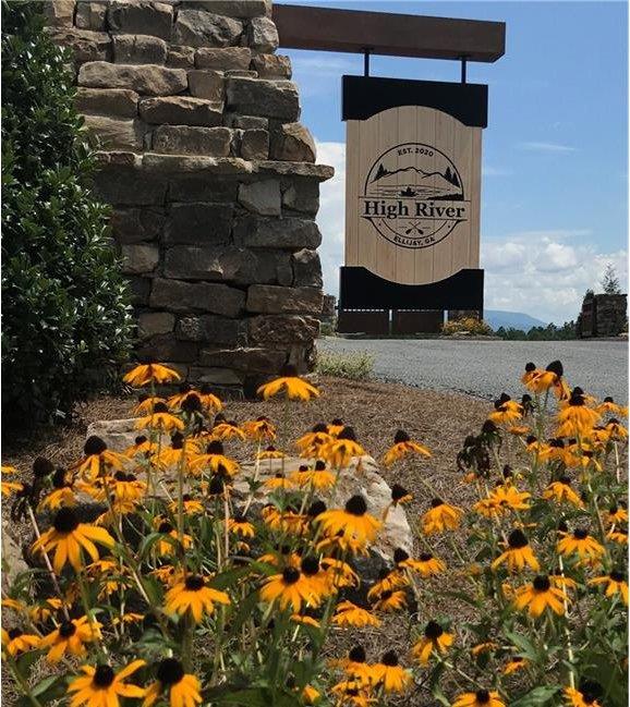 115 Ridge Wood Trail Hiawassee, GA 30546 - Photo 2 of 34 a sign that is sitting in front of a building