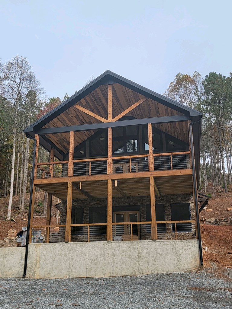 115 Ridge Wood Trail Hiawassee, GA 30546 - Photo 27 of 34 a front view of a house with a yard