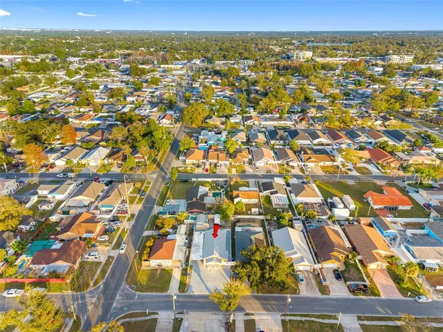 an aerial view of residential houses with outdoor space