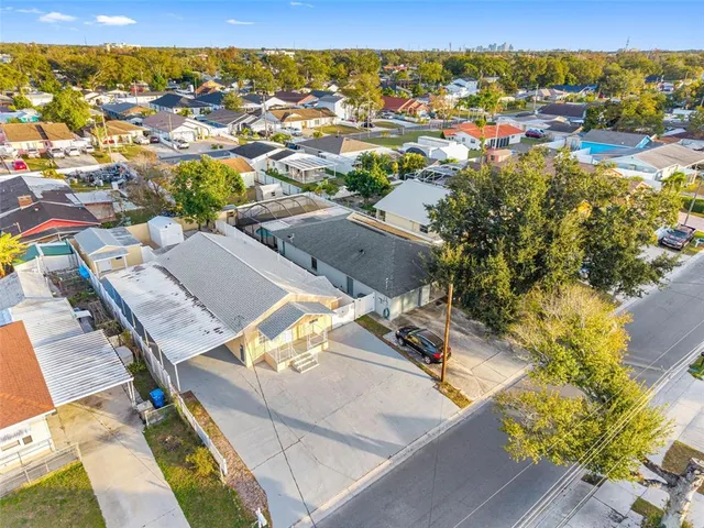 an aerial view of residential houses with outdoor space