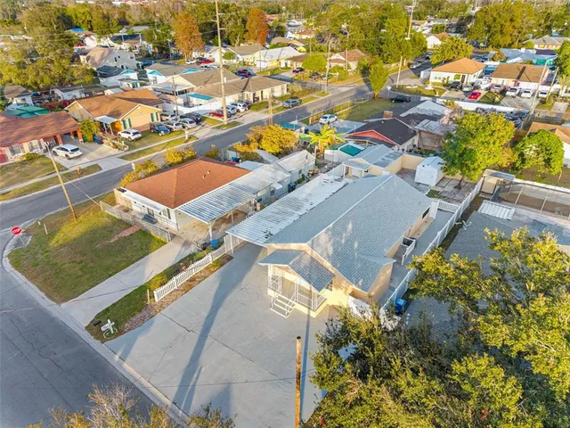 an aerial view of a house with a swimming pool