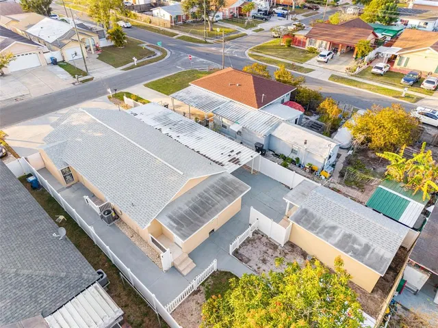 a kitchen with white cabinets and sink