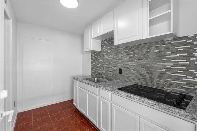 a bathroom with a sink a shower and a mirror