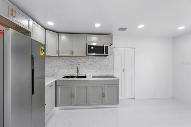 a view of entryway with wooden floor and door