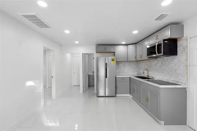 a bathroom with a sink and shower