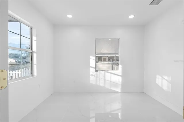 a view of a door and a window