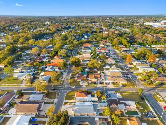an aerial view of residential building with parking