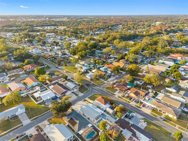 an aerial view of residential houses with outdoor space