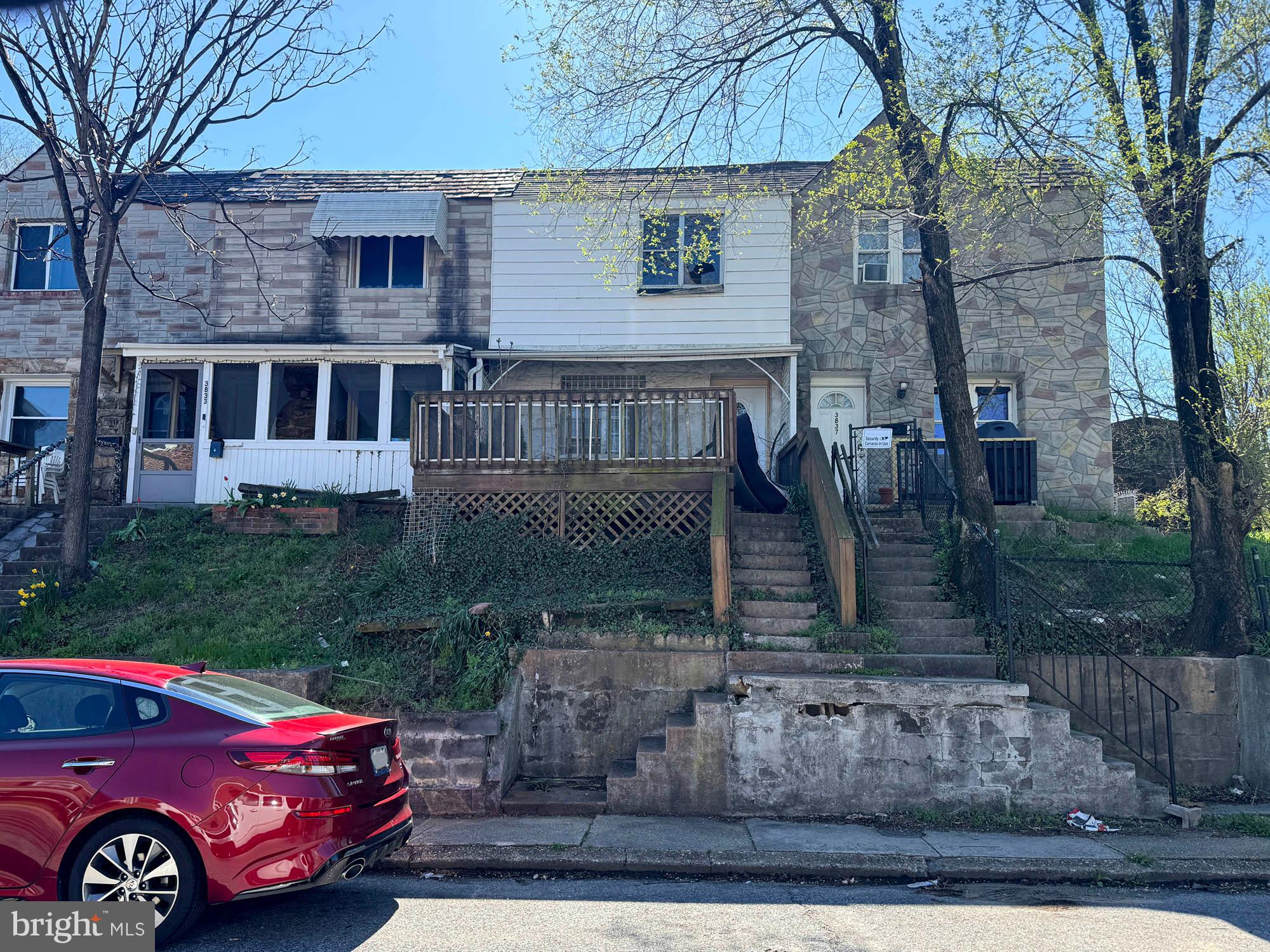 3835 8th Street Baltimore, MD 21225 - Photo 2 of 11 a front view of a house with garden