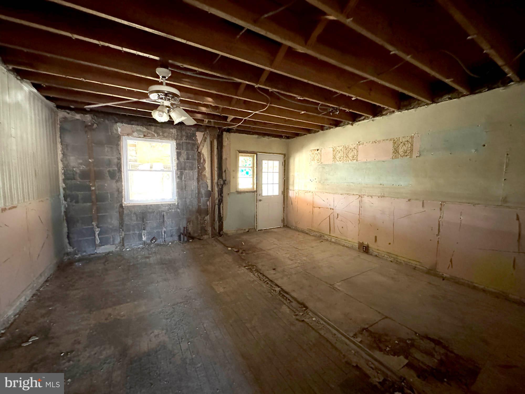 3835 8th Street Baltimore, MD 21225 - Photo 5 of 11 a view of porch with a table and chairs