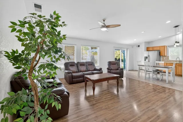 a view of a backyard with a tree