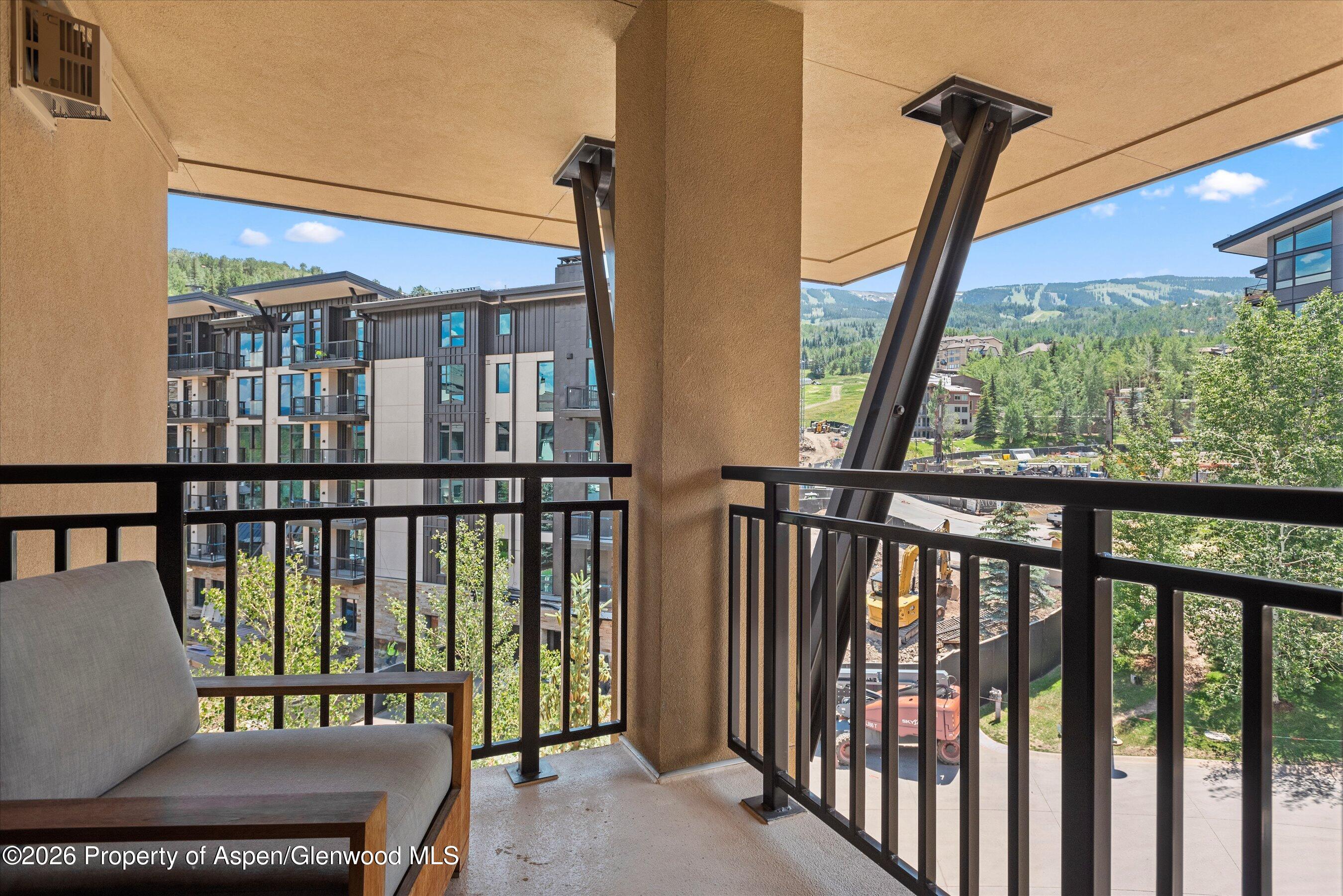 130 Wood Road, Unit 701/801 Snowmass Village, CO 81615 - Photo 15 of 41 a view of a balcony with furniture