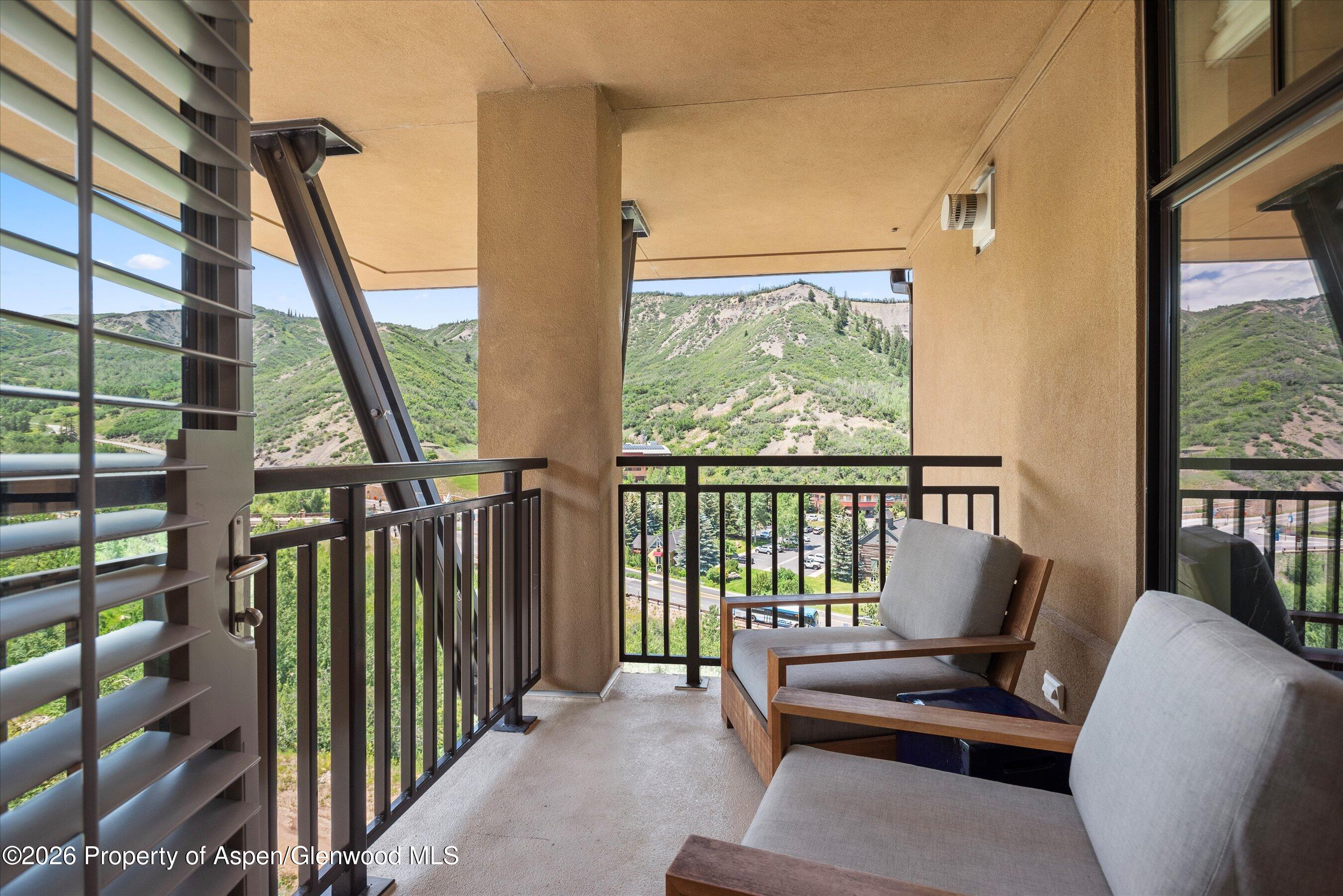 130 Wood Road, Unit 701/801 Snowmass Village, CO 81615 - Photo 16 of 41 a view of chairs in balcony