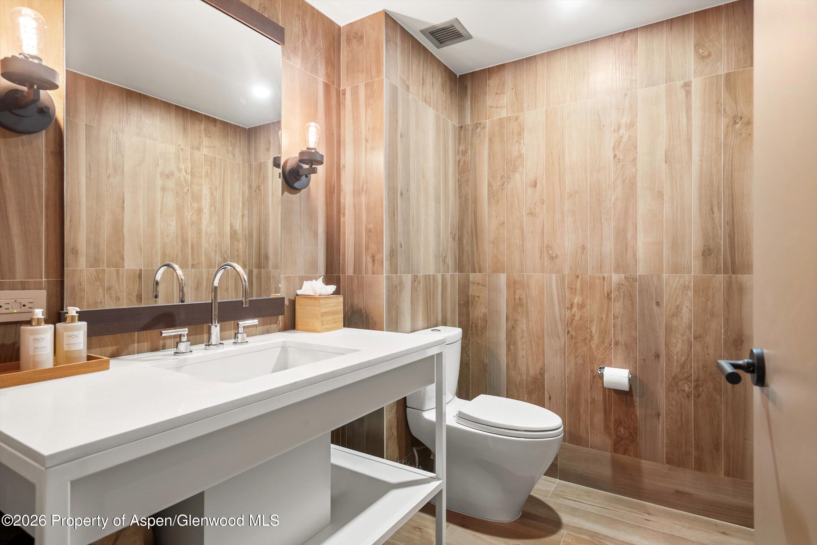 130 Wood Road, Unit 701/801 Snowmass Village, CO 81615 - Photo 29 of 41 a bathroom with a sink a toilet and shower