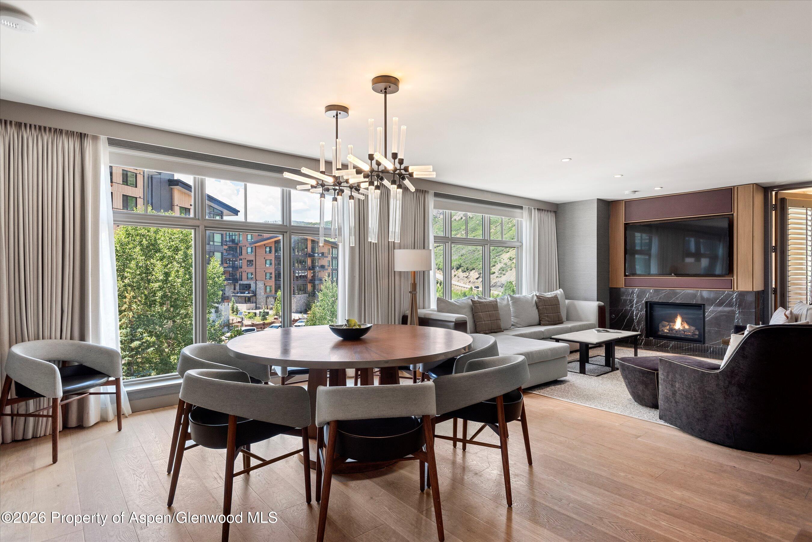 130 Wood Road, Unit 701/801 Snowmass Village, CO 81615 - Photo 3 of 41 a view of a dining room with furniture window and outside view