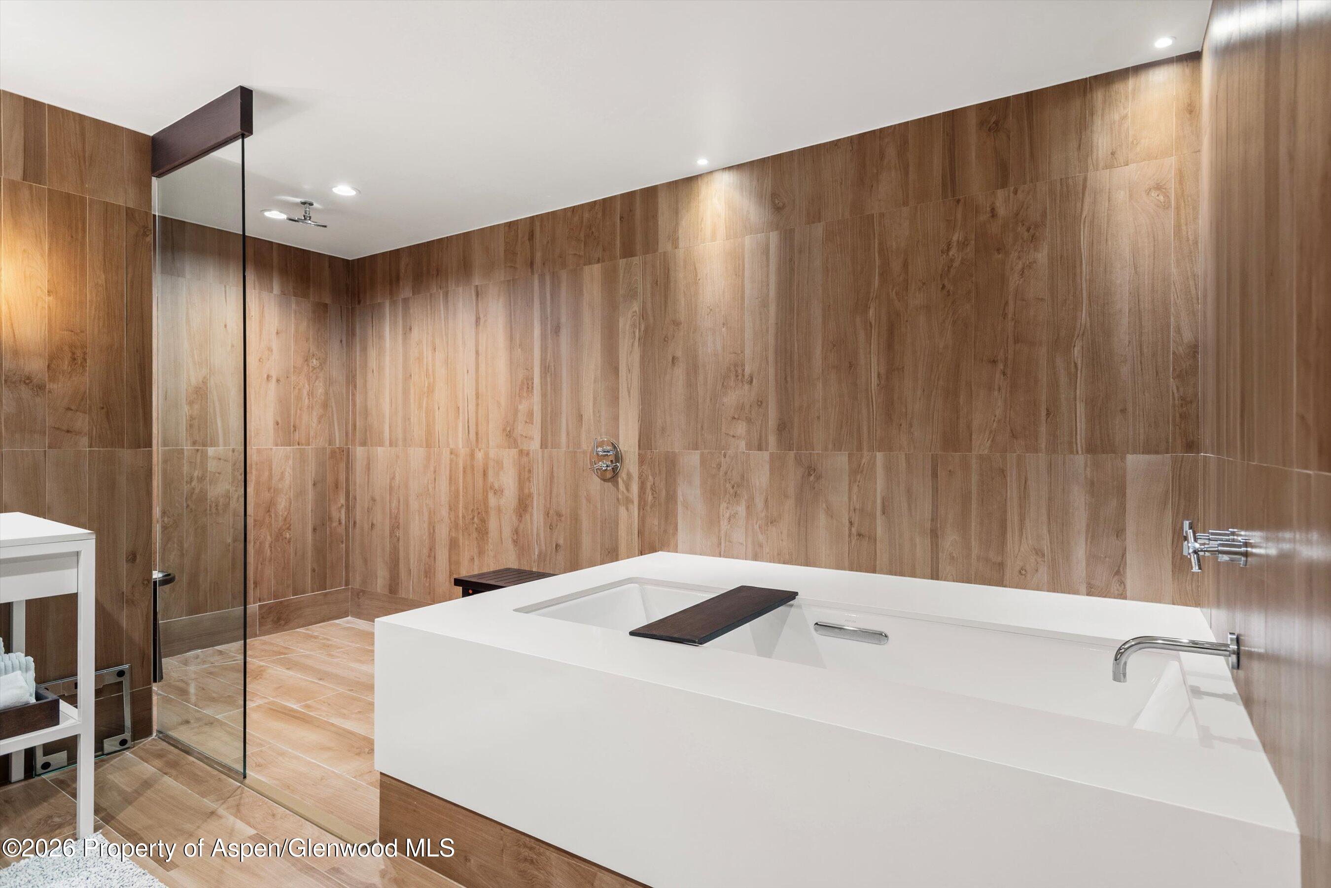 130 Wood Road, Unit 701/801 Snowmass Village, CO 81615 - Photo 32 of 41 a bathroom with a shower and a tub