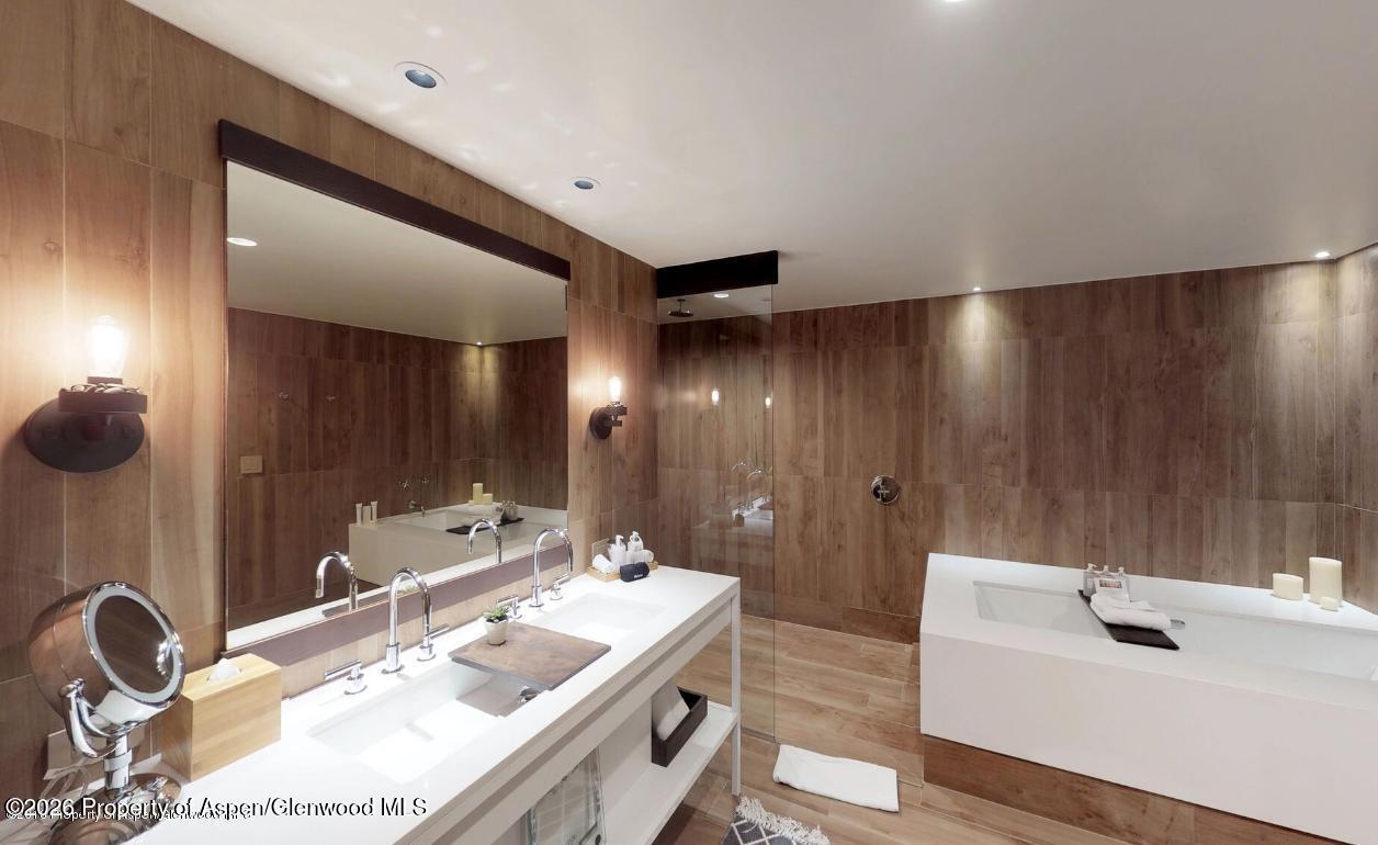 130 Wood Road, Unit 701/801 Snowmass Village, CO 81615 - Photo 33 of 41 a bathroom with a sink and a mirror