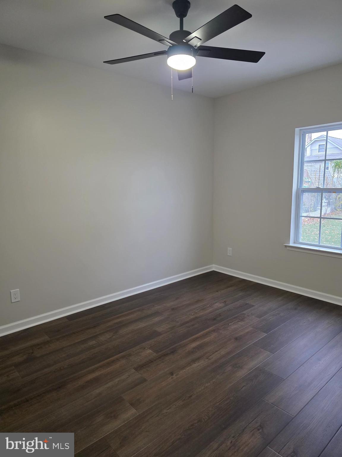 110 Neshaminy Road Croydon, PA 19021 - Photo 12 of 21 a view of an empty room with wooden floor and a window