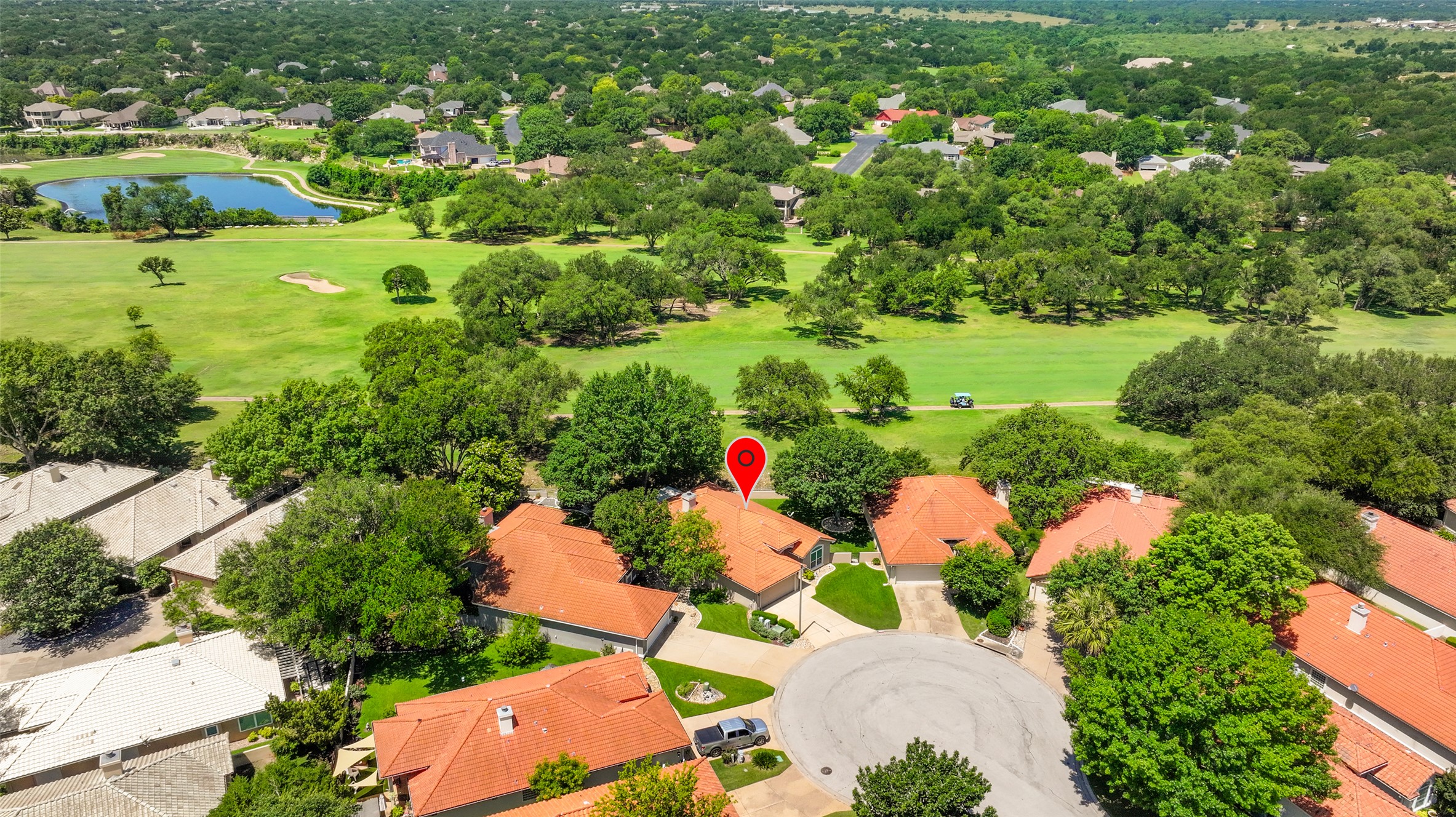 30107 Hamlet Circle Georgetown, TX 78628 - Photo 35 of 40 An aerial perspective showcases a vibrant community nestled alongside a verdant golf course and serene lake.