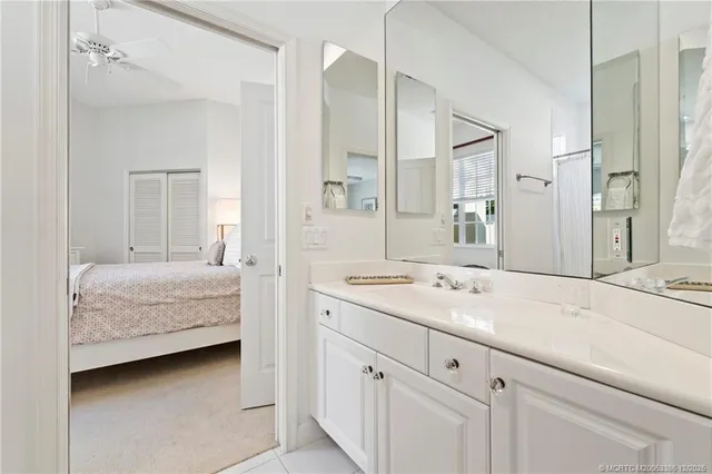 a en suite bathroom with a sink and a mirror