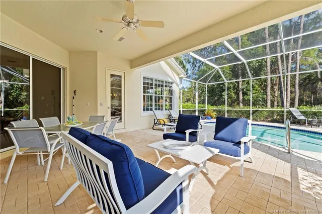 a view of a dining room with furniture window and outside view