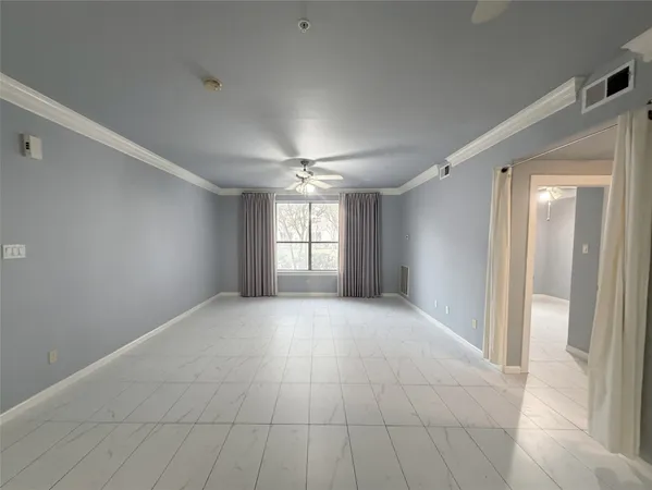 a view of an empty room and window