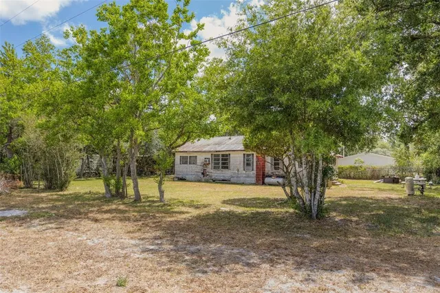 a house with trees in front of it