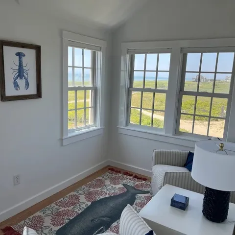 a bedroom with furniture and a window