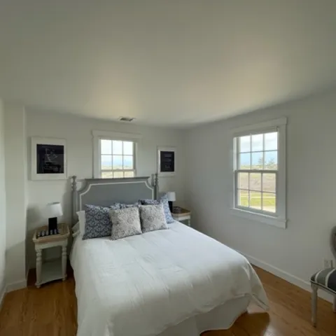 a bedroom with a bed and window