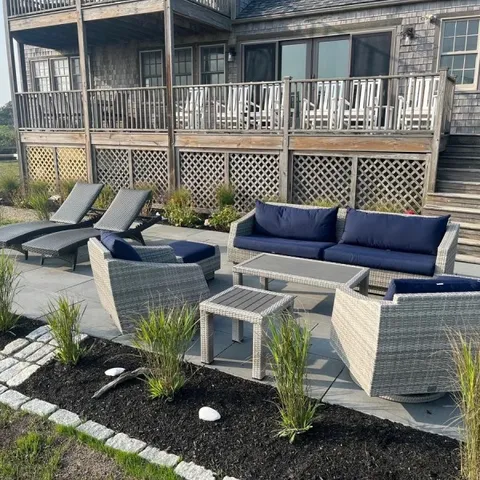 a front view of a house with a bench