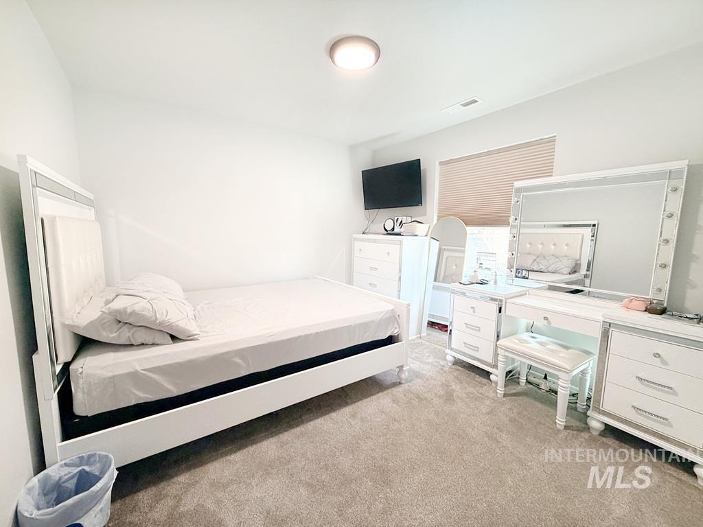 13694 Oliver Street Caldwell, ID 83607 - Photo 17 of 28 Bedroom with light colored carpet