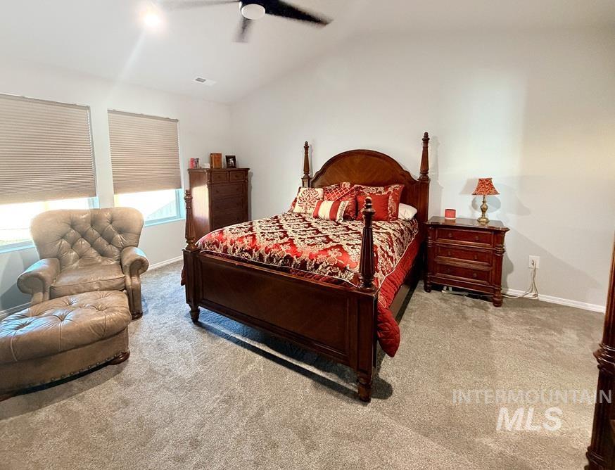 13694 Oliver Street Caldwell, ID 83607 - Photo 20 of 28 Bedroom featuring vaulted ceiling, light colored carpet, and ceiling fan