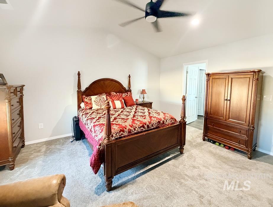 13694 Oliver Street Caldwell, ID 83607 - Photo 21 of 28 Bedroom featuring ceiling fan, light carpet, and vaulted ceiling