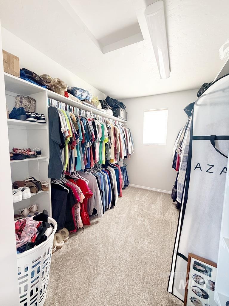 13694 Oliver Street Caldwell, ID 83607 - Photo 25 of 28 Walk in closet featuring light colored carpet
