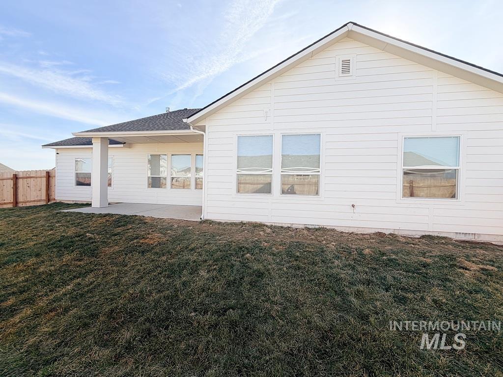 13694 Oliver Street Caldwell, ID 83607 - Photo 26 of 28 Back of property featuring a patio area and a fenced backyard