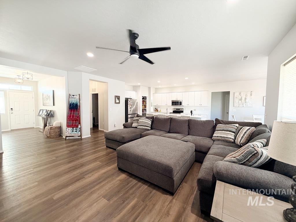 13694 Oliver Street Caldwell, ID 83607 - Photo 7 of 28 Living area with wood finished floors, ceiling fan, and recessed lighting