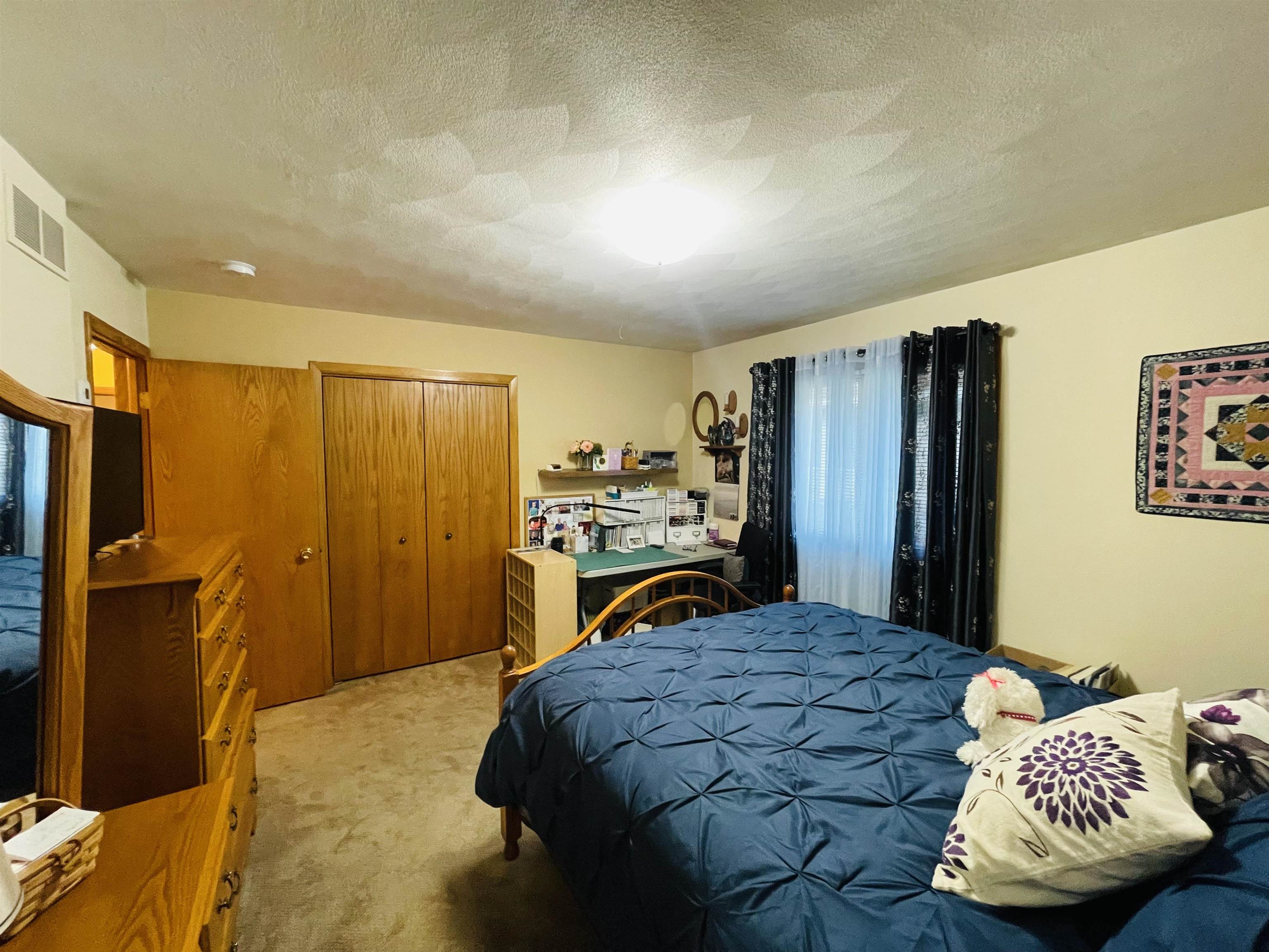 1292 South Trainer Road Rockford, IL 61108 - Photo 10 of 17 a bedroom with a bed and a couch