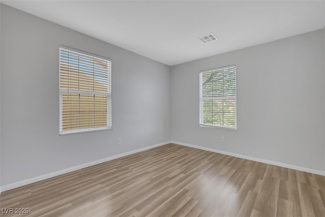 4549 Lime Straight Drive Las Vegas, NV 89115 - Photo 12 of 21 Unfurnished room with baseboards and light wood-type flooring