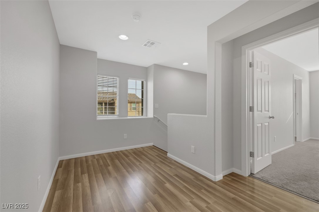 4549 Lime Straight Drive Las Vegas, NV 89115 - Photo 10 of 21 Empty room featuring light wood-type flooring and recessed lighting
