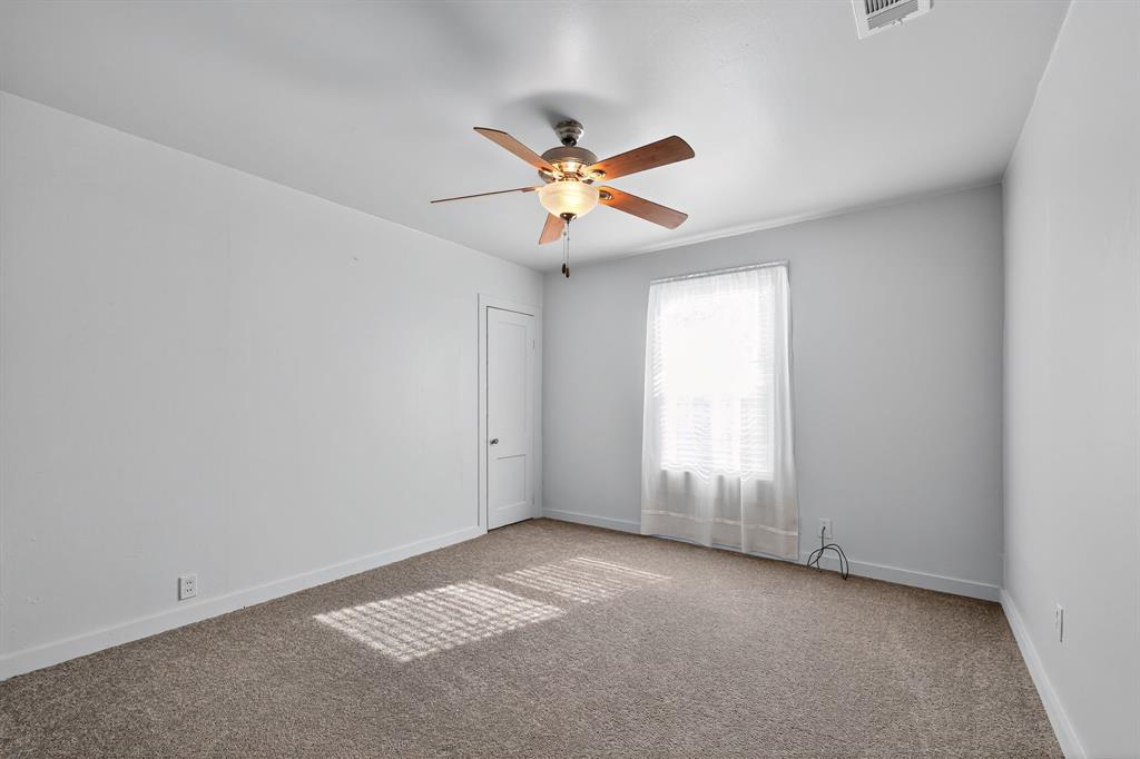 5485 Highway 7 Marlin, TX 76661 - Photo 20 of 36 Carpeted empty room with baseboards and a ceiling fan