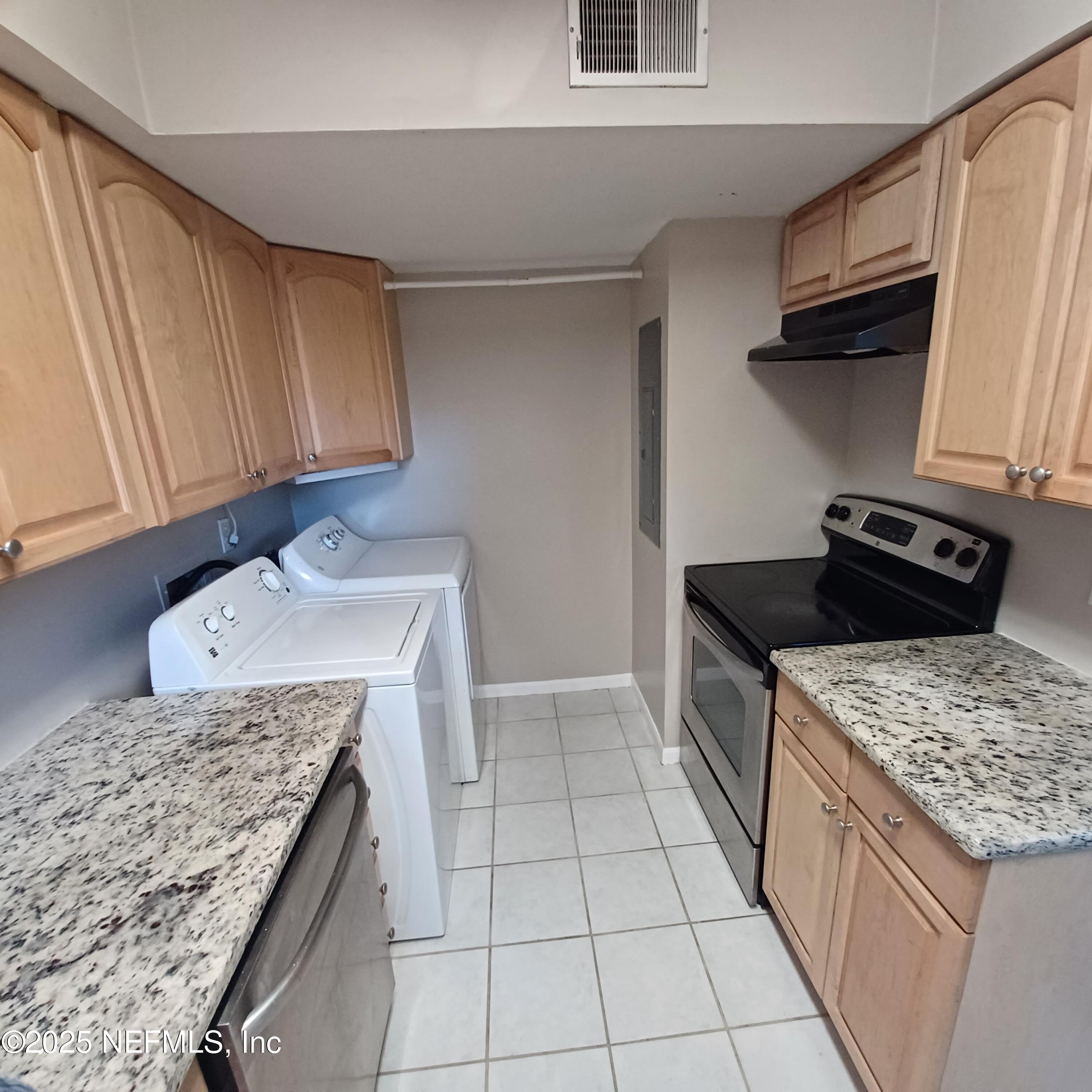 307 Kettering Terrace Orange Park, FL 32073 - Photo 4 of 16 a kitchen with a sink stove and cabinets