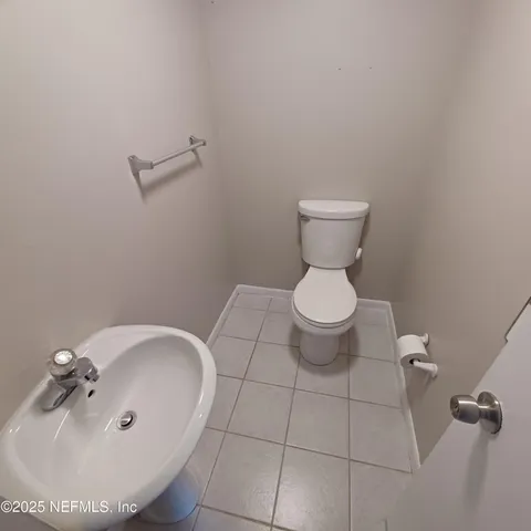 a bathroom with a toilet and a sink
