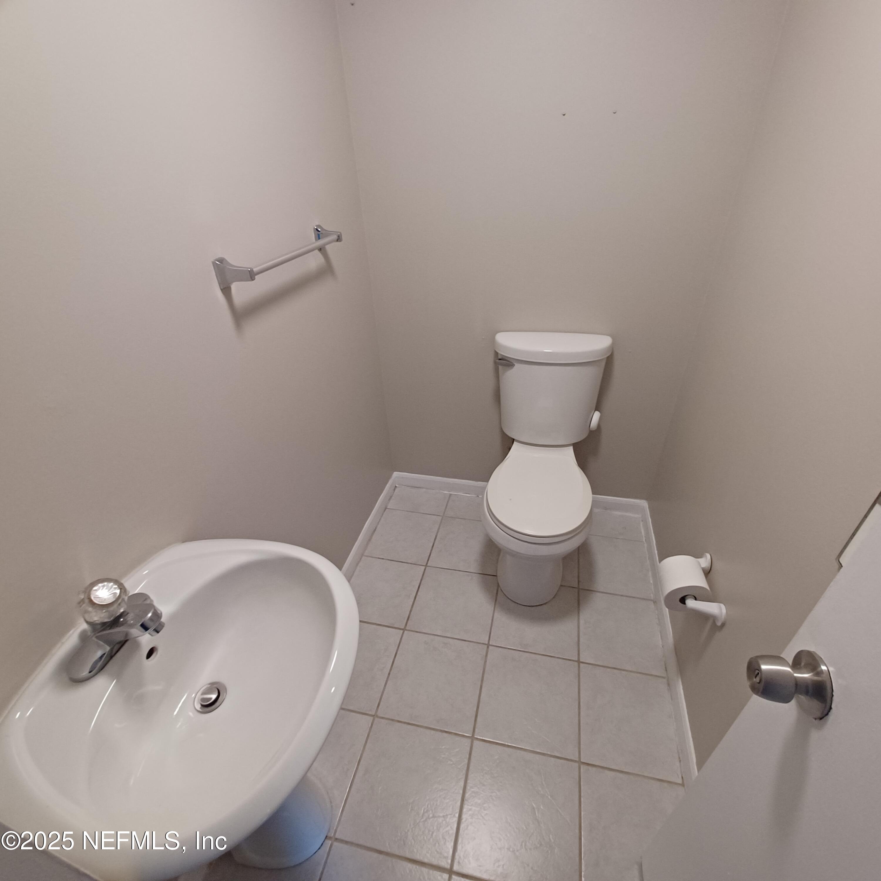 307 Kettering Terrace Orange Park, FL 32073 - Photo 6 of 16 a bathroom with a toilet and a sink