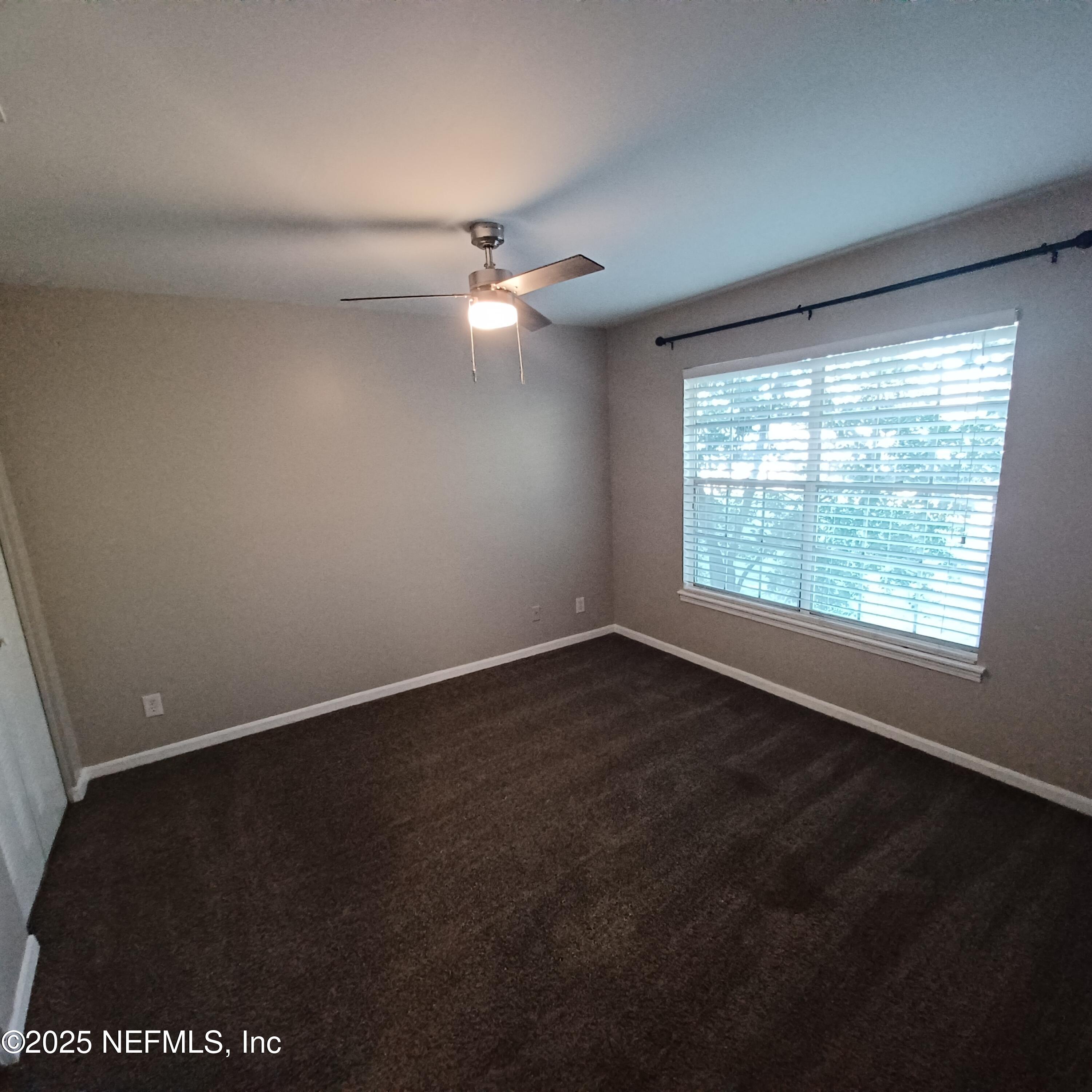 307 Kettering Terrace Orange Park, FL 32073 - Photo 9 of 16 an empty room with a window