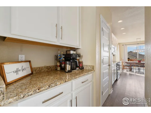 a kitchen with stainless steel appliances granite countertop a refrigerator and cabinets